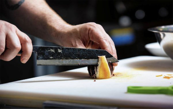 Person cutting vegetables