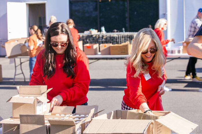 Lexie Knight and Kate Jones assembling packs